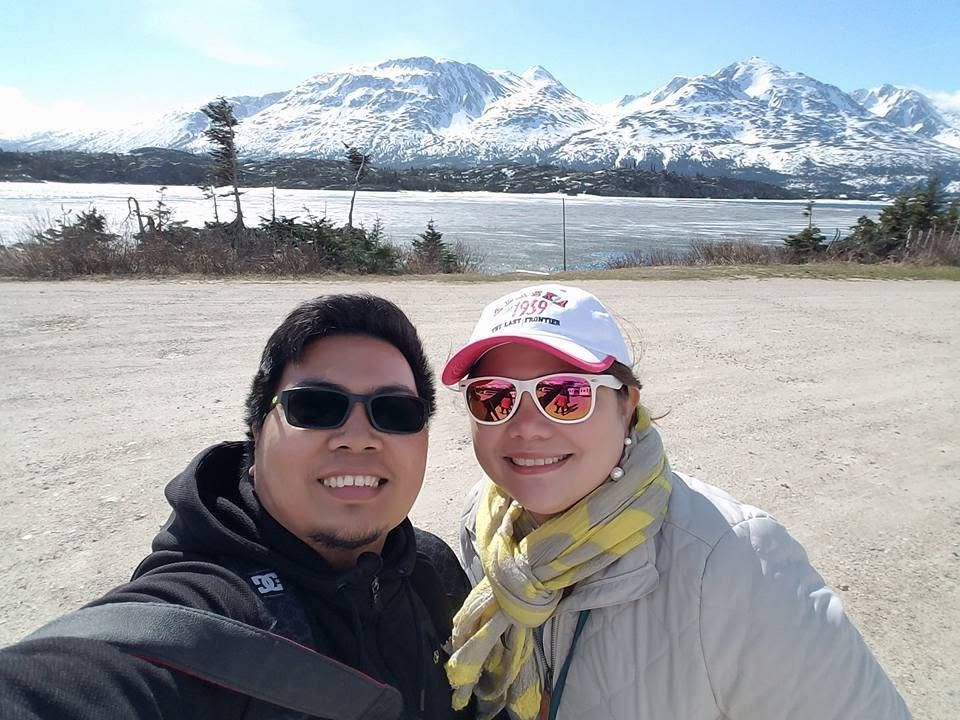 Rochelle and Nathaniel together in front of an Alaskan glacier